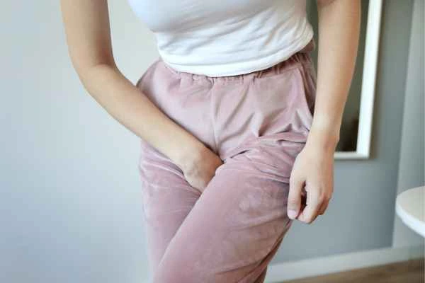 woman running for the toilet because of urinary incontinence Ayr